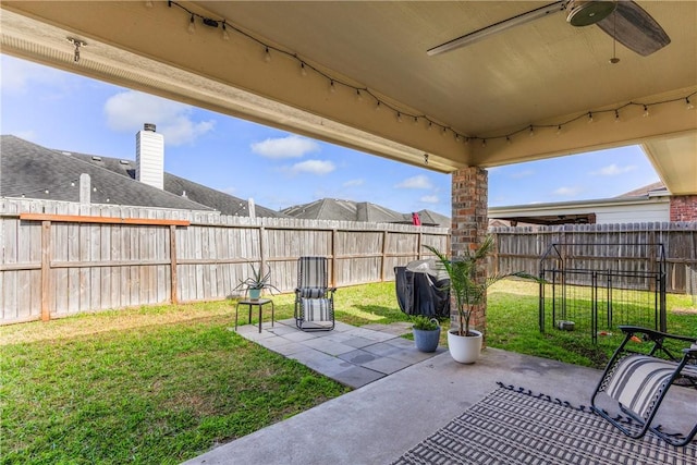 view of patio with ceiling fan and a fenced backyard