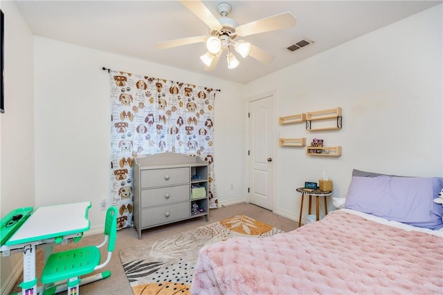 carpeted bedroom with baseboards, visible vents, and ceiling fan