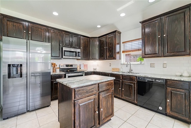 5921 Tapestry Dr, Corpus Christi, TX 78414 - kitchen featuring stainless steel appliances, a sink, light tile patterned floors, light stone countertops, and recessed lighting