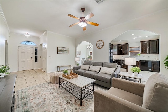 5921 Tapestry Dr, Corpus Christi, TX 78414 - living area with arched walkways, ceiling fan, crown molding, baseboards, and light tile patterned floors