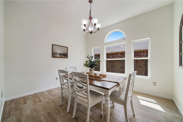 5921 Tapestry Dr, Corpus Christi, TX 78414 - dining room with a chandelier, wood finished floors, and baseboards