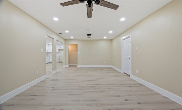 unfurnished room featuring ceiling fan and light hardwood / wood-style flooring