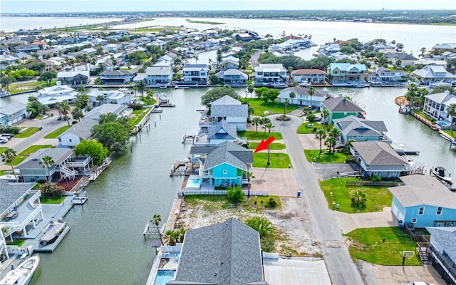 aerial view with a water view and a residential view