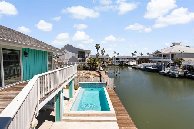 22 Whooping Crane Ln, Rockport, TX 78382 - view of swimming pool featuring a deck with water view and stairway