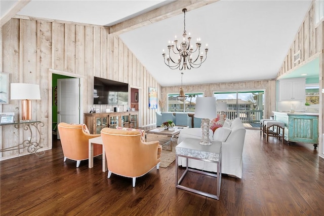 living room featuring wood finished floors, a chandelier, wood walls, and vaulted ceiling with beams