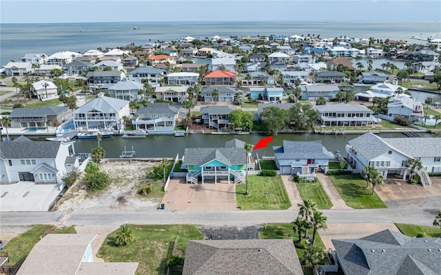 bird's eye view with a water view and a residential view