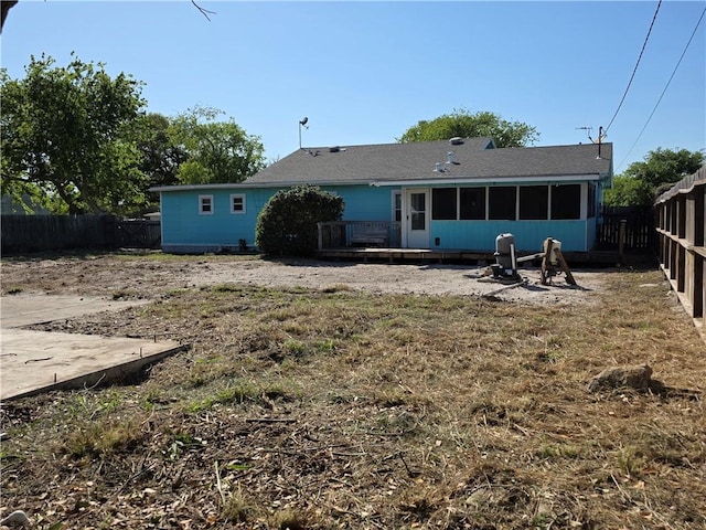325 S Saunders St S, Aransas Pass, TX 78336 - rear view of house with a sunroom and a fenced backyard