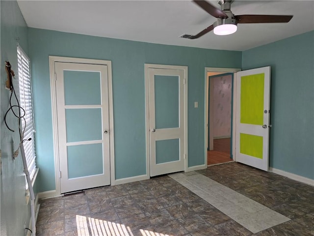 325 S Saunders St S, Aransas Pass, TX 78336 - interior space with baseboards, ceiling fan, stone finish floor, and visible vents