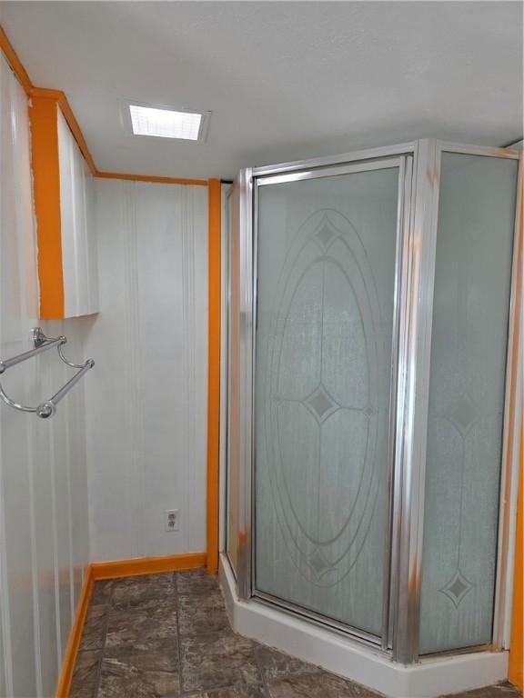 325 S Saunders St S, Aransas Pass, TX 78336 - full bath featuring baseboards, visible vents, stone finish floor, and a shower stall