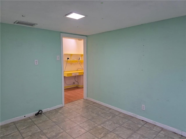 325 S Saunders St S, Aransas Pass, TX 78336 - spare room featuring baseboards and visible vents