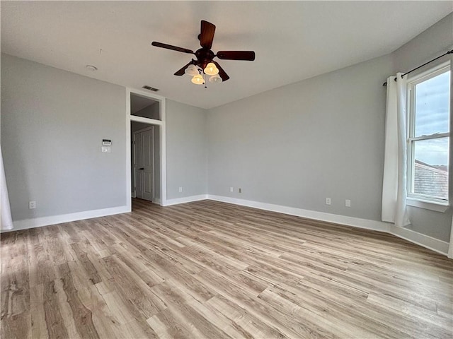 unfurnished room featuring ceiling fan and light wood-type flooring