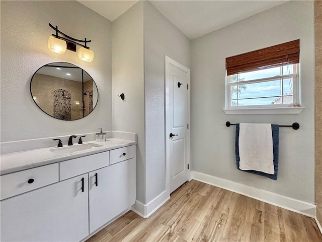 bathroom with vanity and wood-type flooring