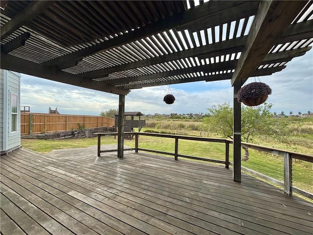 wooden deck with a pergola and a yard