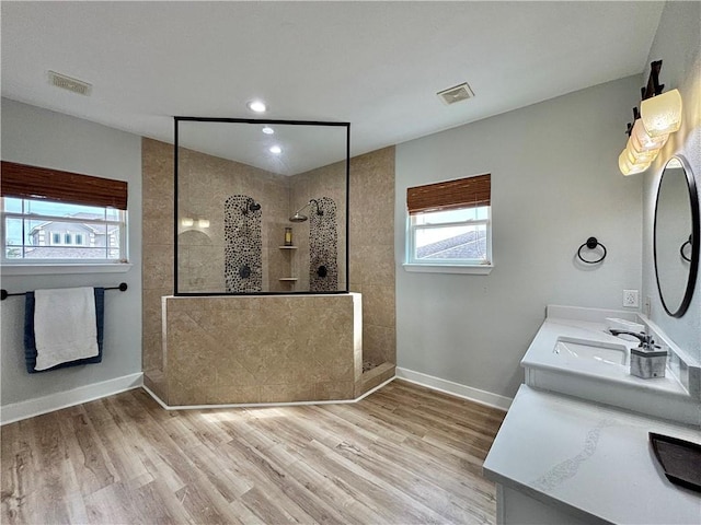 34 Virginia Hills Dr, Corpus Christi, TX 78414 - bathroom featuring a walk in shower, wood finished floors, double vanity, and recessed lighting