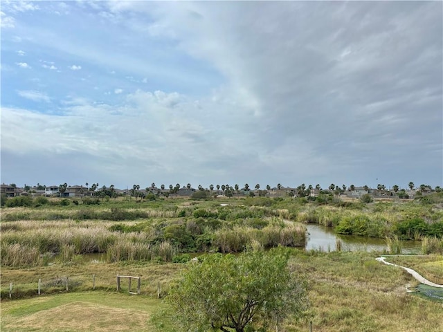 view of local wilderness featuring a rural view and a water view