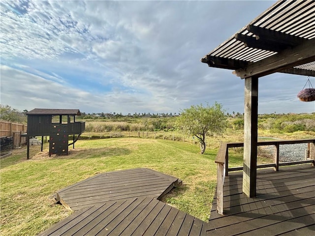 deck featuring a pergola and a lawn