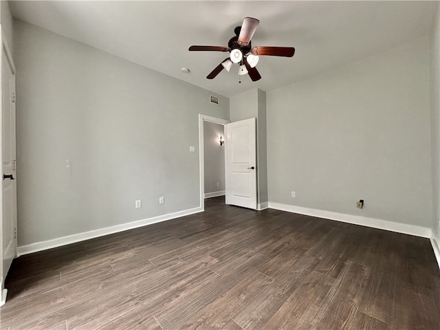 unfurnished bedroom with ceiling fan and dark hardwood / wood-style floors