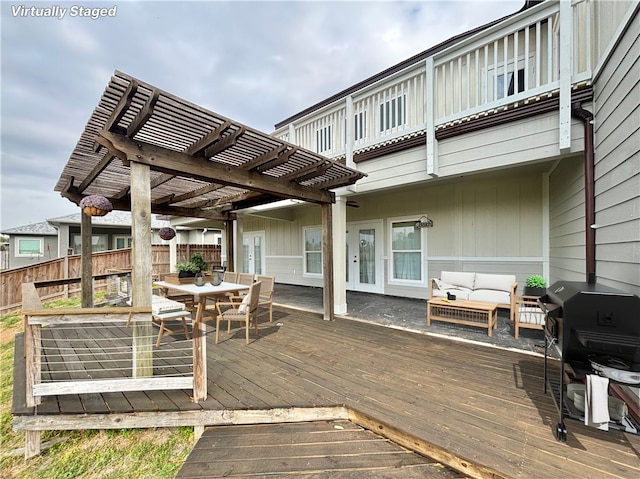 deck with a pergola and an outdoor living space