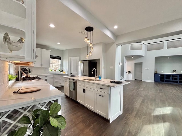 34 Virginia Hills Dr, Corpus Christi, TX 78414 - kitchen featuring stainless steel appliances, light countertops, dark wood finished floors, white cabinetry, and recessed lighting