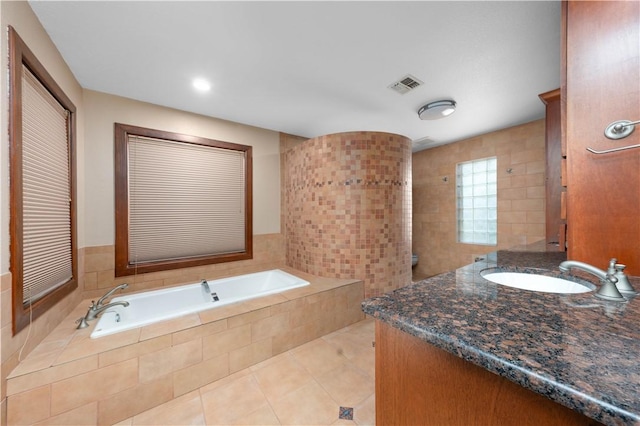 8018 Mt Zion, Corpus Christi, TX 78413 - full bathroom featuring a garden tub, vanity, and tile patterned flooring
