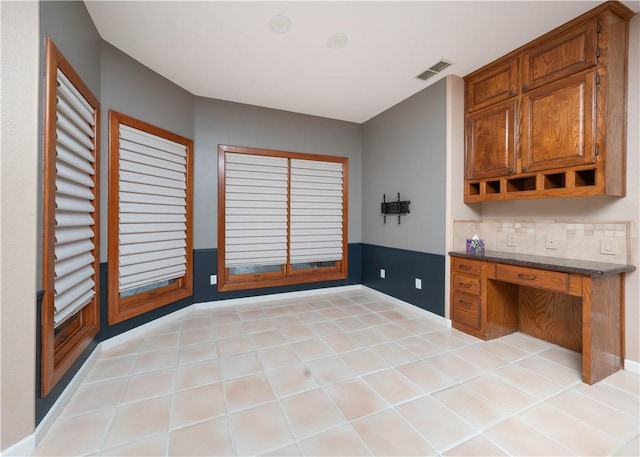 8018 Mt Zion, Corpus Christi, TX 78413 - kitchen with brown cabinets, baseboards, dark countertops, and open shelves