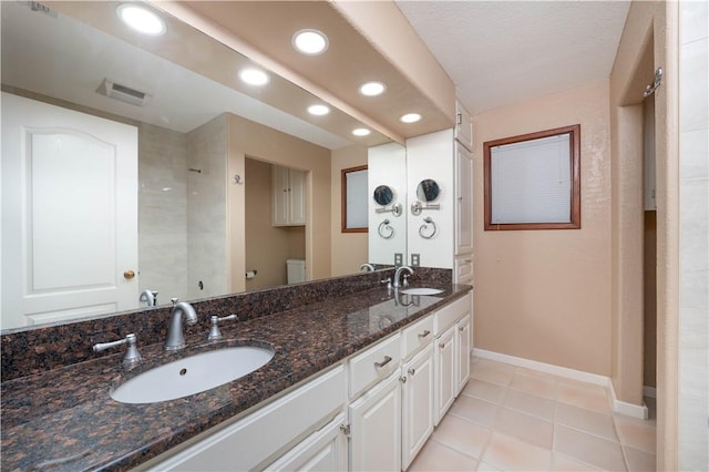8018 Mt Zion, Corpus Christi, TX 78413 - full bathroom featuring recessed lighting, double vanity, baseboards, toilet, and tile patterned floors