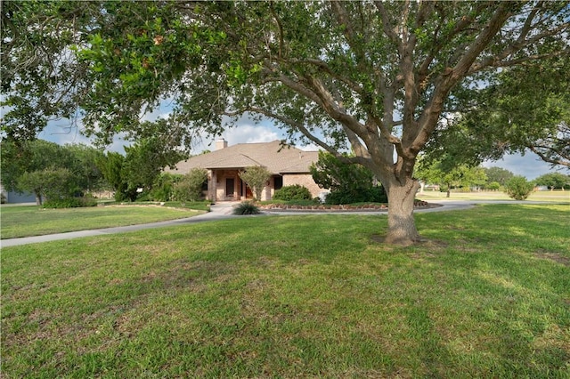 8018 Mt Zion, Corpus Christi, TX 78413 - view of front of home with a front yard and a chimney