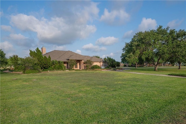 8018 Mt Zion, Corpus Christi, TX 78413 - view of front of property with a front lawn and a chimney