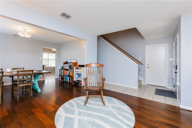 living area with hardwood / wood-style floors