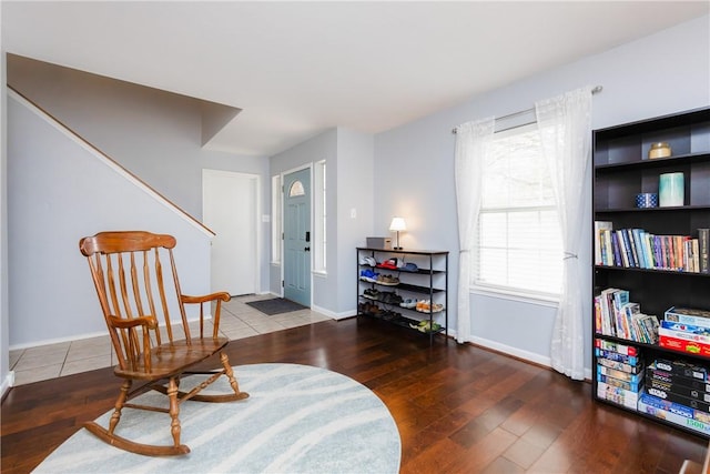 living area with hardwood / wood-style flooring