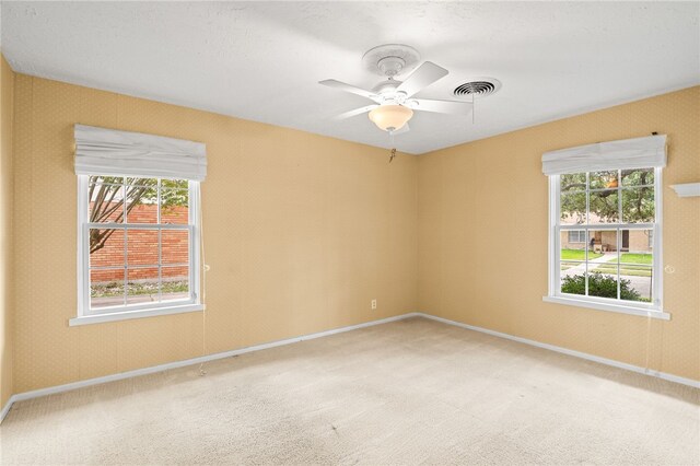 4410 Marie St, Corpus Christi, TX 78411 - unfurnished room with light colored carpet, ceiling fan, and baseboards