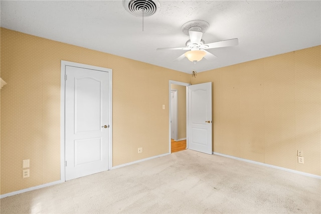 4410 Marie St, Corpus Christi, TX 78411 - unfurnished bedroom featuring carpet, baseboards, and ceiling fan