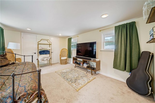 living area with baseboards, recessed lighting, and carpet flooring