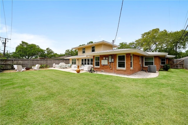 back of house with a patio, an outdoor living space with a fire pit, central air condition unit, a yard, and a fenced backyard