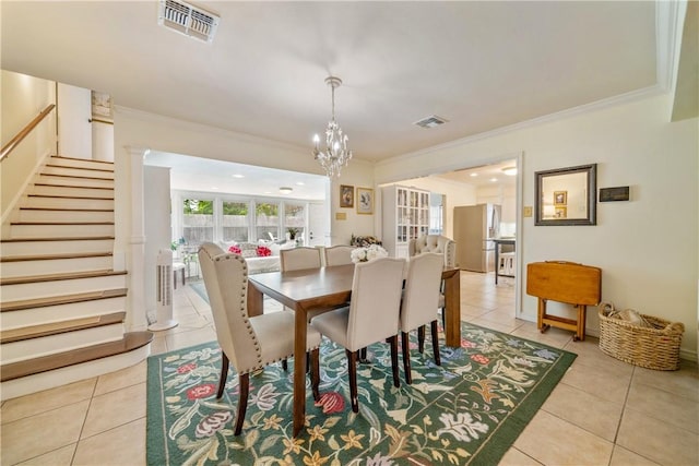 dining room featuring visible vents, light tile patterned floors, stairs, and crown molding