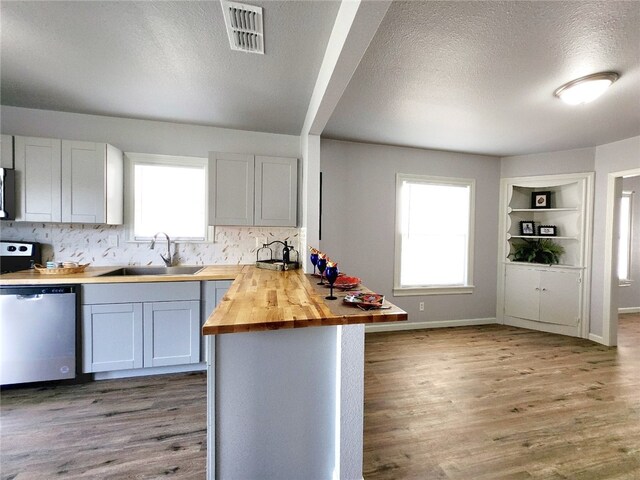 unfurnished living room with hardwood / wood-style floors and ceiling fan