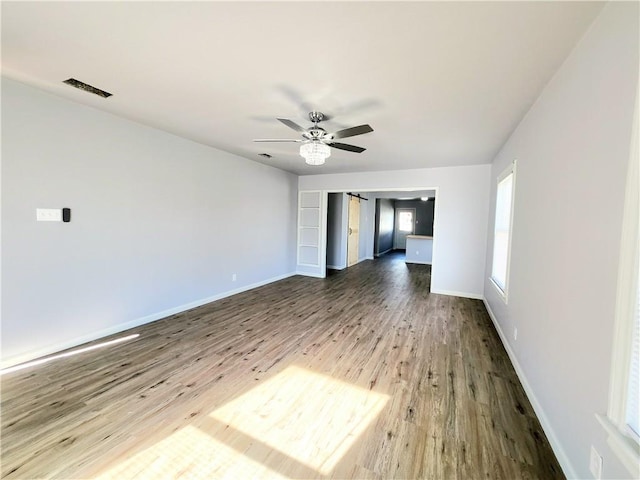 spare room featuring ceiling fan and hardwood / wood-style floors