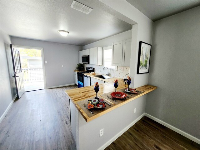 unfurnished living room featuring ceiling fan and light hardwood / wood-style floors