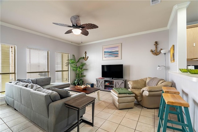 living room featuring ceiling fan, light tile patterned floors, and crown molding