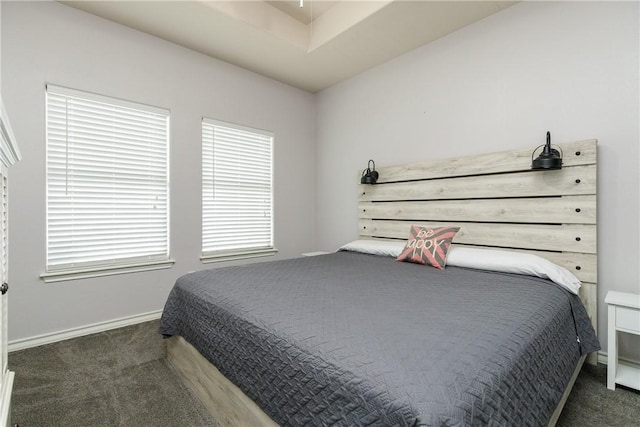 bedroom featuring dark colored carpet