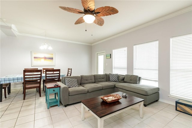 living room with ceiling fan with notable chandelier, light tile patterned floors, and crown molding