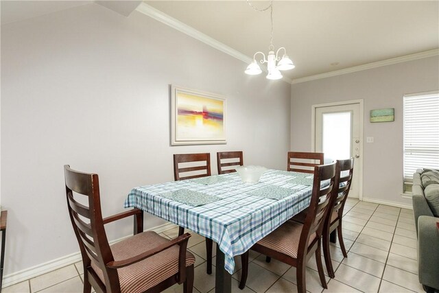 dining space featuring crown molding, a notable chandelier, and light tile patterned flooring