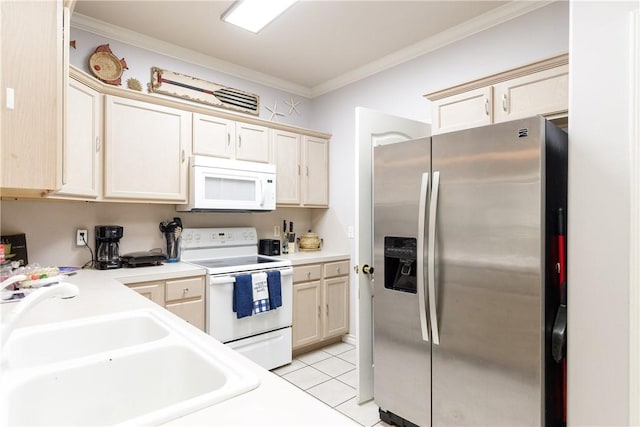 kitchen featuring crown molding, light tile patterned floors, sink, and white appliances