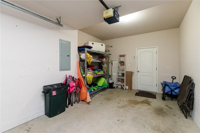 garage featuring a garage door opener and electric panel