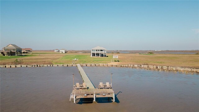 299 Bay Dr, Palacios, TX 77465 - dock area with a water view and a lawn