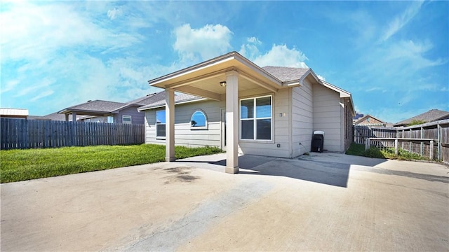 exterior space with a patio, a yard, and fence private yard