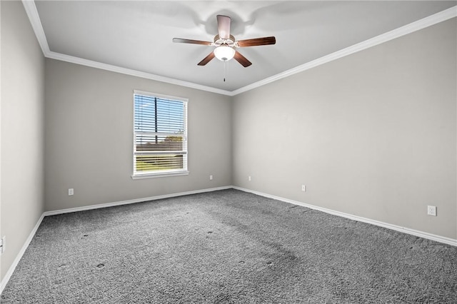 empty room featuring carpet flooring, baseboards, crown molding, and ceiling fan