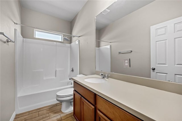 bathroom with bathing tub / shower combination, vanity, wood tiled floor, and toilet