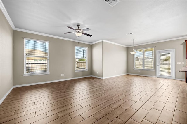 unfurnished room featuring a healthy amount of sunlight, ceiling fan, ornamental molding, and visible vents