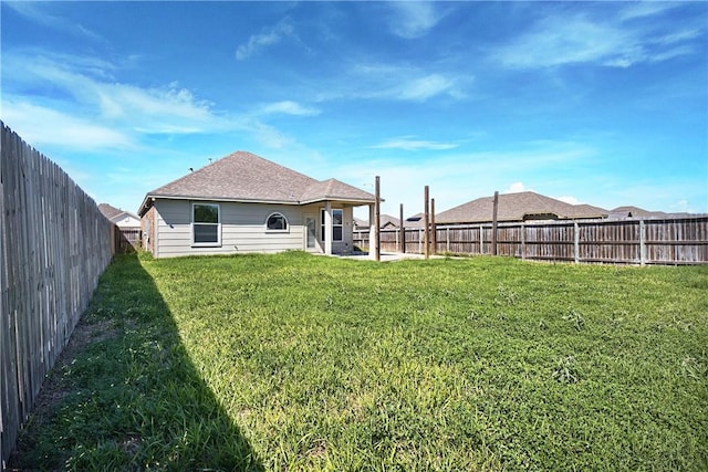 view of yard featuring a patio area and a fenced backyard
